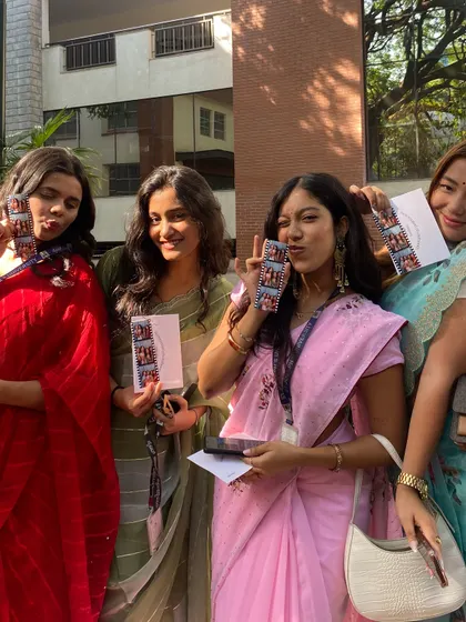 Posing for the camera with friends and a fresh set of photo strips. These are the moments that will be cherished for years to come.
