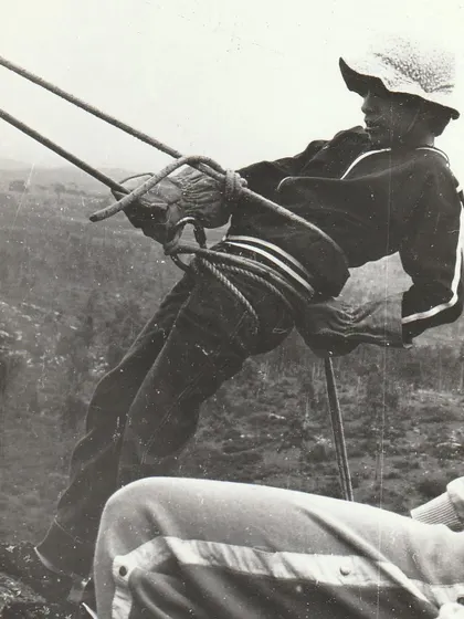 A young climber learning to rappel in the 1980s, using classic techniques. It's amazing to see how the gear has evolved, but the spirit of adventure remains the same.