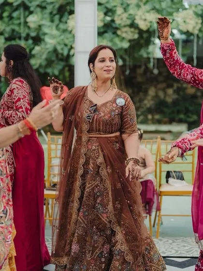 Guests enjoying a dance session during a daytime carnival event. I focus on capturing the movement and colorful attire that make these moments so lively.