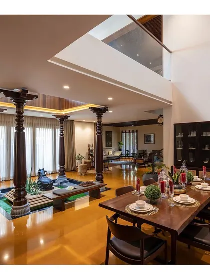 The heart of a home is often a central courtyard. Here, traditional Chettinad pillars ground the modern open-plan living space, creating a tranquil core that connects the entire family.