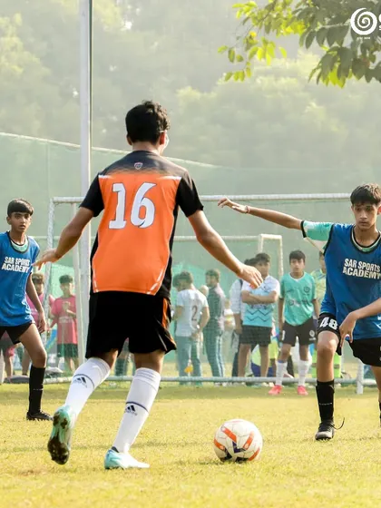 A player prepares to pass the ball to a teammate.