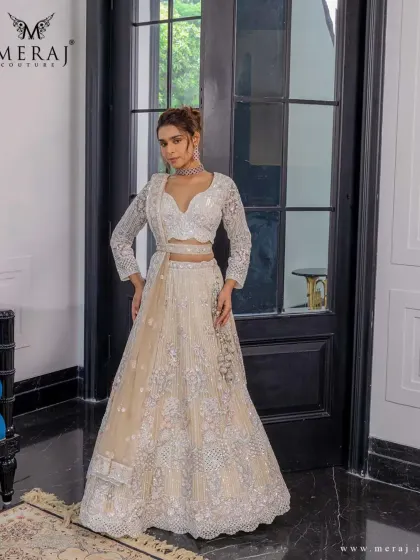 A full view of the elegant lehenga, showcasing its delicate thread textures and floral embroidery, perfect for the bride who embodies subtle luxury.