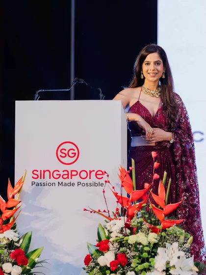 Posing confidently at the Singapore "Passion Made Possible" event. As a host, it is my job to embody the client's message, and here I aimed to project the passion and professionalism Singapore is known for.