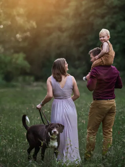A duplicate of ID 28, this full family portrait, complete with the family dog, captures the joy of a family outing in nature.