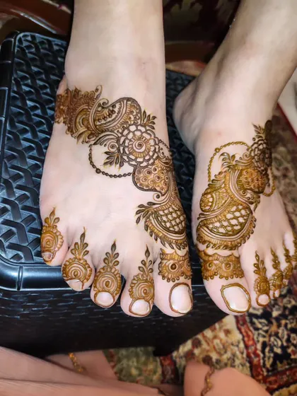 A slightly different angle of the intricate foot design, showing the beautiful details on the toes.