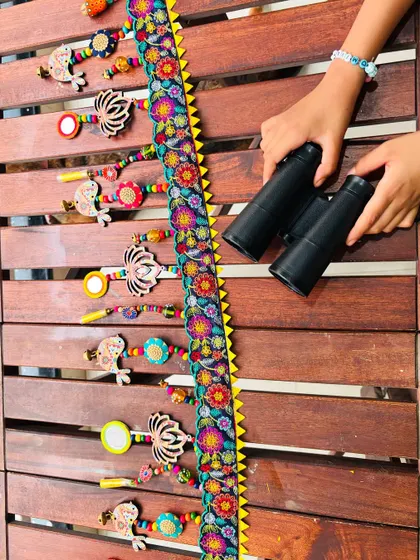 My little helpers showing off the 'TAMAARA' toran. It’s a piece that brings the whole family together, full of color, warmth, and soul.