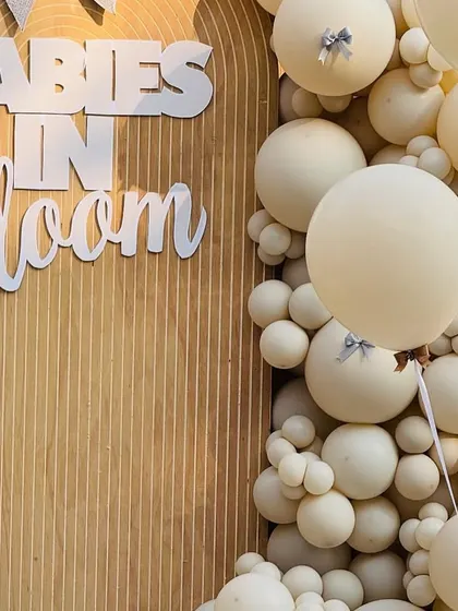 The combination of large and small balloons in a monochromatic scheme creates a visually stunning texture.
