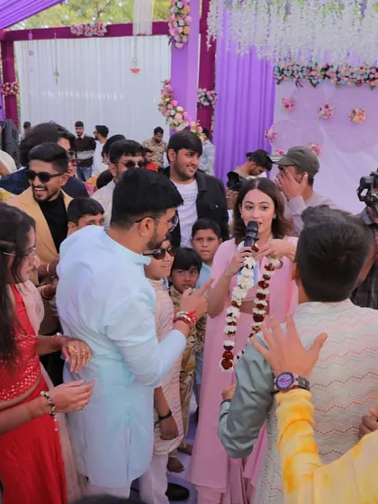 In the middle of the crowd, making sure everyone is part of the game. For me, hosting a Haldi is about creating a circle of fun that includes every single guest.