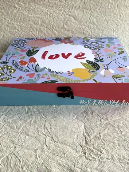 The finished box, personalized with the wedding hashtag #SAJKISHAADI, making it a memorable keepsake.