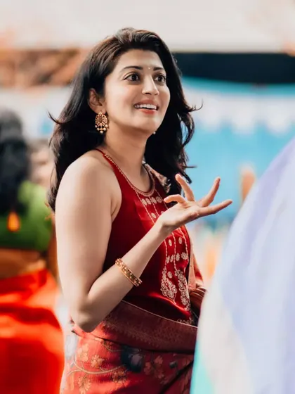 Another candid shot of actress Pranitha Subhash, captured mid-conversation. Her expressive gesture and genuine smile showcase a relaxed and approachable personality.