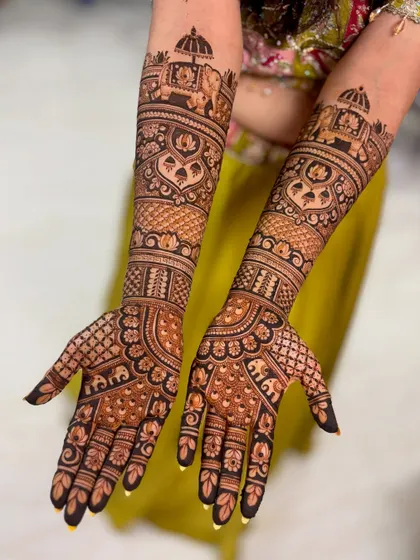 A majestic bridal mehendi with elephant processions and intricate architectural motifs.