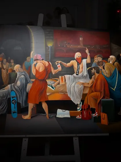 The 'Death of Socrates' painting on its easel at night. The dramatic lighting changes the mood of the piece completely.