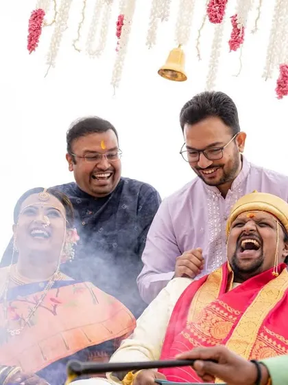 Laughter and fun during the wedding rituals, capturing the candid joy of a destination celebration.