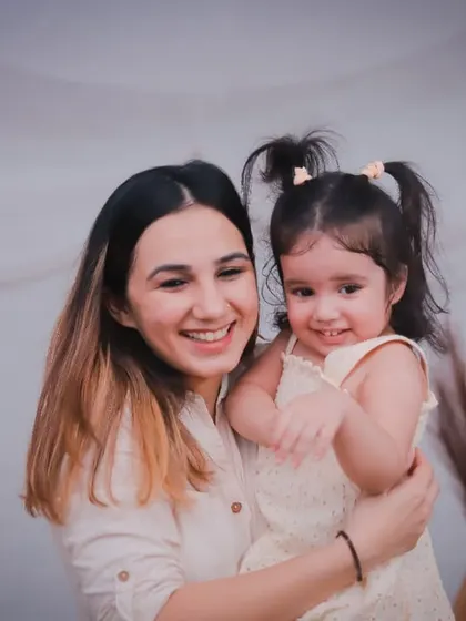 A big, happy smile from mom and a cheeky grin from her daughter. Capturing genuine joy is what we do best.