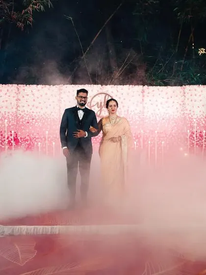 A dramatic entrance for the couple with fog machines and sparklers, creating a truly cinematic moment.