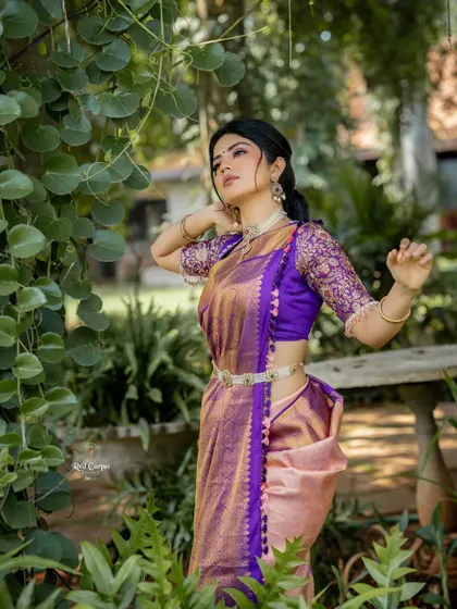 Megha Shetty looking graceful in a garden setting, showcasing the beautiful fall of the purple Kanjivaram saree from my 'Navataara' collection.