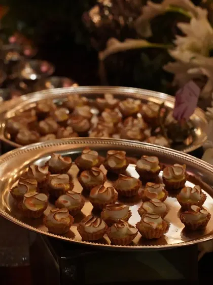 Trays of mini lemon meringue tarts, beautifully torched and ready to be served. This image showcases our delicate and delicious dessert canapés, perfect for satisfying a sweet tooth.