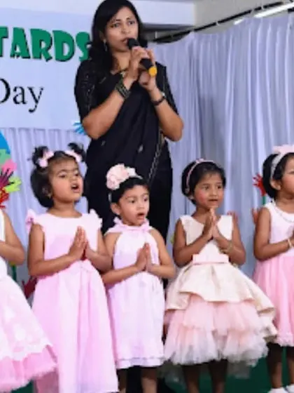 A group of girls performing a song for their families. Our Family Day is a wonderful opportunity for children to showcase their talents and build their confidence on stage.