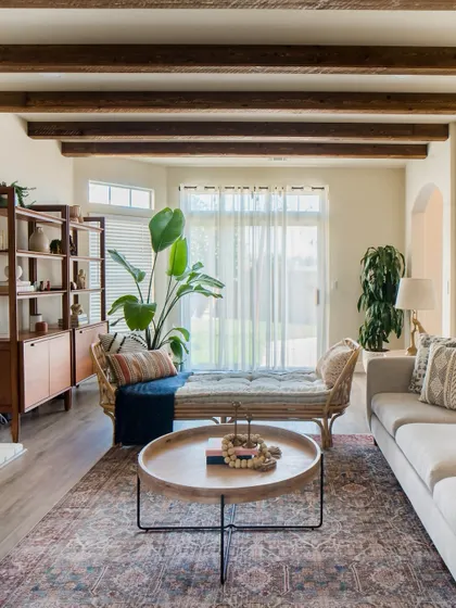 This woven daybed adds a touch of bohemian flair to a California-casual living room. It's perfect for separating a large space without blocking the line of sight.