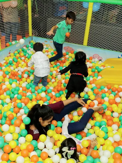 The ball pit is pure chaos and joy! Kids and even some brave adults had a fantastic time playing together during the Cinderella-themed celebration.