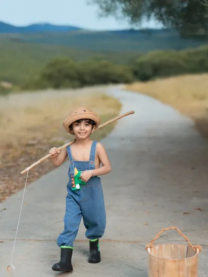 Off on a fishing adventure. This shot captures the joy of exploration during our outdoor fishing-themed photoshoot.