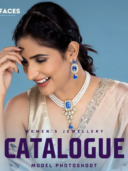 This cheerful shot features a model wearing a pearl necklace with a blue gemstone pendant. The bright smile and clean lighting make it a perfect image for a brand's website or social media feed.