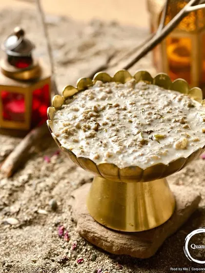 Another look at the Mutton Irani Keema, showcasing its presentation with rustic props that evoke a sense of tradition and authenticity.