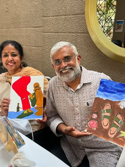 A happy couple with their unique paintings at the Birkenstock event. It's a great way to spend quality time and create something together.