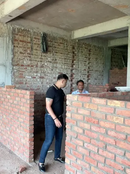 Planning the layout for a new space within the raw brick structure. This is where the vision starts to take physical form.