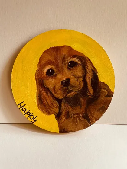 A simple and sweet portrait of a puppy named Happy on a small, round canvas. The bright yellow background makes his adorable face shine.