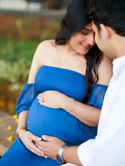 A close-up shot focusing on their hands on the baby bump. It’s a tender portrait that highlights their connection and the shared love for their unborn child.