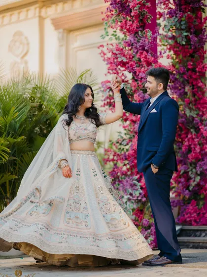 A beautiful moment from a ring ceremony, with the couple framed by a vibrant floral arch. This shows my ability to capture not just pre-wedding shoots, but also the key celebrations leading up to your wedding day.
