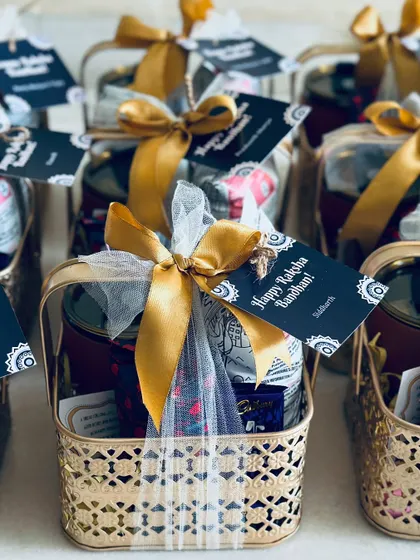 The combination of the golden basket, satin ribbon, and personalized tag makes our Rakhi hamper a truly luxurious and memorable gift.