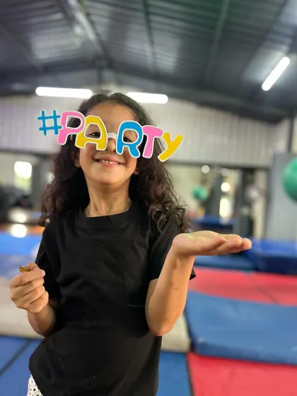 A cute and playful pose. This student is ready to party and have a great time with her friends.