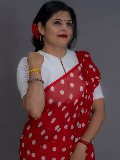 A red and white polka dot saree, styled with a high-neck white blouse and a red flower in my hair. This is another take on the classic retro theme.