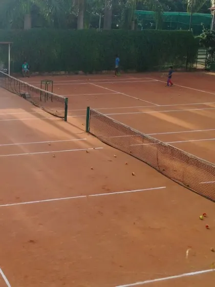 A wide view of our professionally maintained clay tennis courts, ready for training and tournament play. We provide top-tier infrastructure to ensure athletes have the best environment to perform.
