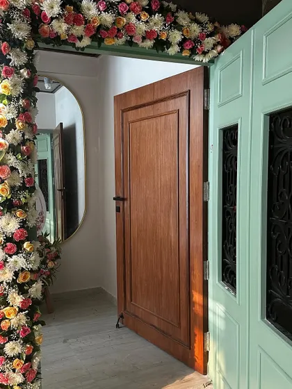 The entrance to our 'Modern Muse' project, decorated with flower garlands for the housewarming ceremony.