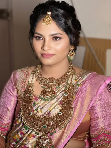 A beautiful example of a soft glam look. The focus is on the eyes, with a wash of color and defined lashes, while the skin remains fresh and natural.