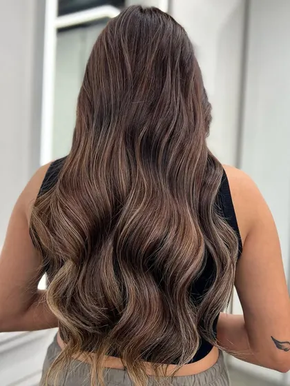 My signature balayage technique adds beautiful, natural-looking dimension. This look is all about creating soft, flowing color.