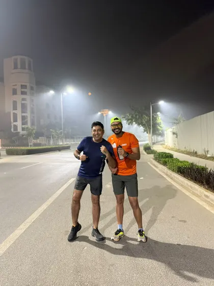 Two of our runners on a foggy night run. We train at all hours to fit our members' busy lives.