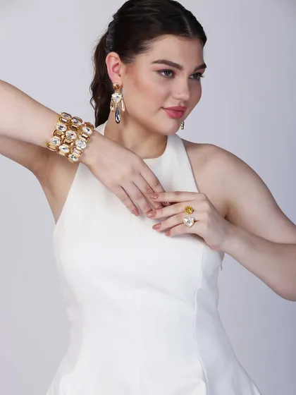 A slightly different composition, this shot provides a clear view of the jewellery's design while maintaining a high-fashion feel for a brand lookbook.