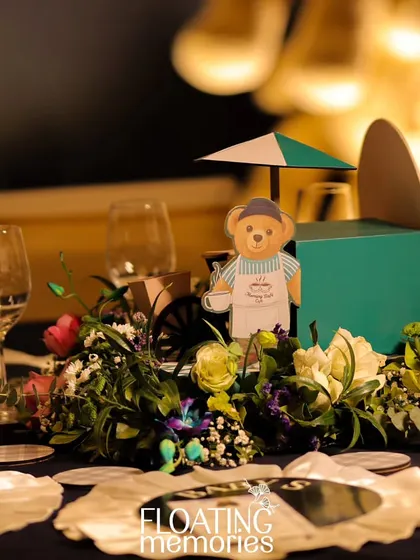 A wider view of the centerpiece, showing how it creates a focal point on each guest table.