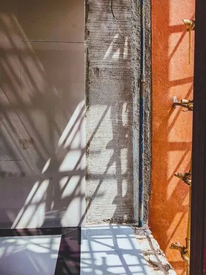 A detail shot of the play of light and shadow on the Arihant Aspire clubhouse during construction.