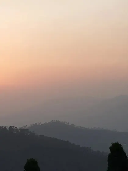 The soft light of dusk over the hills reminds us of the gentle fading of our own inner noise. This is the peaceful atmosphere that supports our letting go retreat.