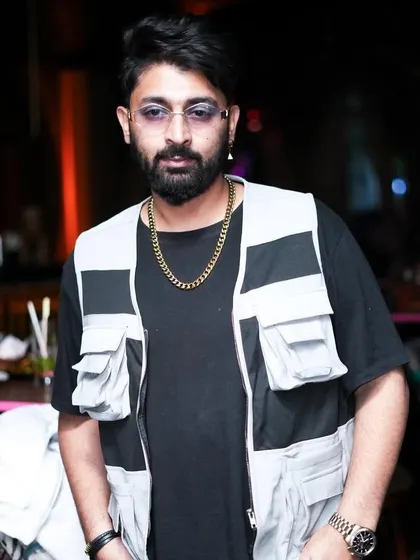 A candid shot, looking cool and collected during a Saturday night set.