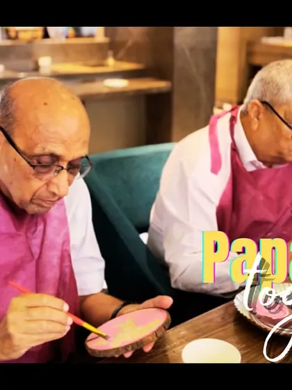Two papas, painting together. It's never too late to try something new, and these gentlemen proved it at a family birthday celebration.