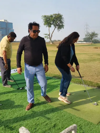 A couple getting a feel for the game on our putting green. It's a fun activity for everyone to try, regardless of experience.