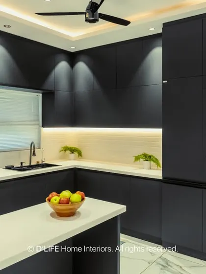 A bold, all-black modular kitchen that makes a powerful statement. Handleless cabinets and integrated appliances create a seamless, ultra-modern look, enhanced by strategic lighting.