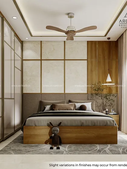 A warm and inviting bedroom with a fabric headboard, wood-paneled wall, and a large Aristo wardrobe with a champagne profile.