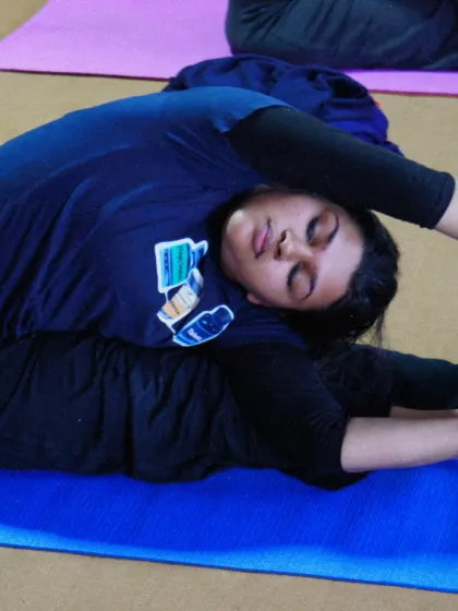 A student deep in Janu Sirsasana, the head to knee forward bend. Our courses focus on holding postures to develop flexibility and a meditative state of mind.